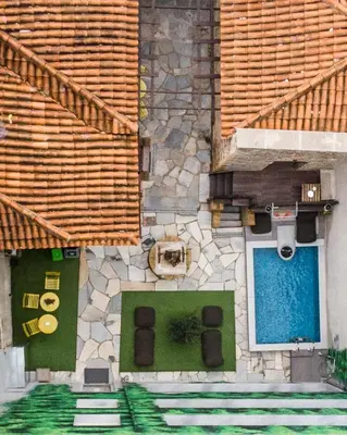 a model of a building with a pool at Athenian Residences in Athens