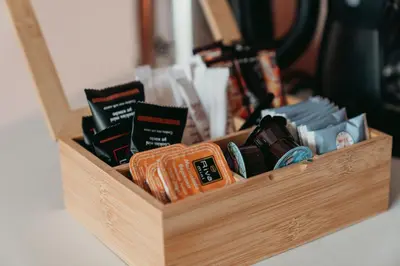 a wooden box filled with different types of books at The Historical Center Studios in Athens