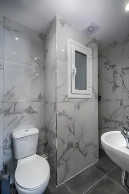 a bathroom with a toilet and a sink at The Historical Center Studios in Athens