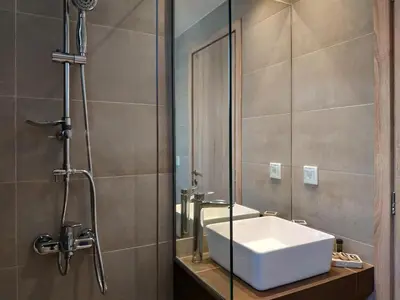 a bathroom with a sink and a shower at Lilly Apartments in Athens