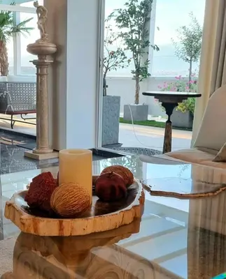 a table with a candle and some donuts on it at One 360 Skyline Athens Penthouses in Athens