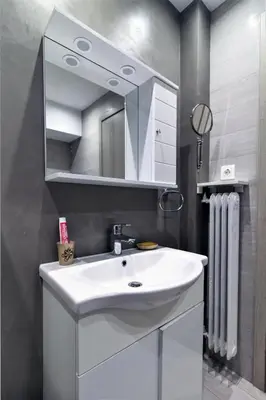 a bathroom with a white sink and a mirror at Best neighbourhood apartment in Athens near metro station & hospitals in Athens