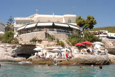 a group of people in the water at a resort at Panorama Hotel in Agia Marina Aegina
