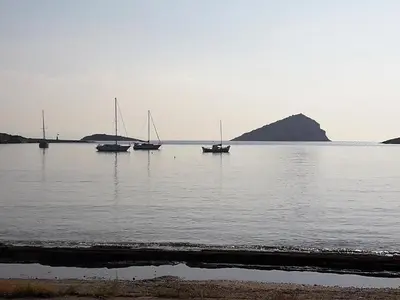 a group of boats sitting in the water at Kalos Gialos Sunrise Apartment in Porto Rafti