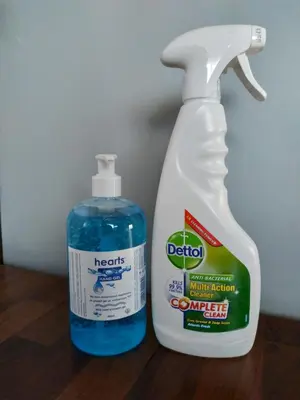 a bottle of detergent next to a bottle of bleach at Vravrona Artemis Home & Transfer Airport in Artemida