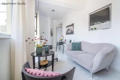 a living room with a couch and a table at Apollo & Artemis by Heloni Apartments in Athens