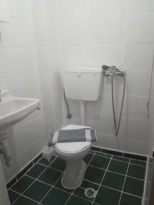 a bathroom with a toilet and a sink at Ikaros in Piraeus
