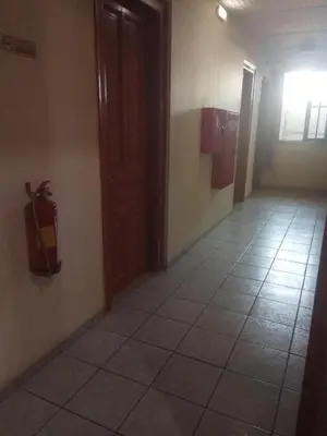 a room with a fire extinguisher on the wall at Ikaros in Piraeus