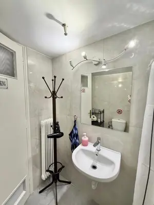 a bathroom with a sink and a mirror at Petaluda House 3 in Athens