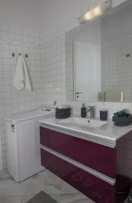 a bathroom with a sink and a mirror at Familygroupflat in Athens