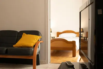 a living room with a couch and a mirror at Scent Of Freedom Apartment Renovated in Athens