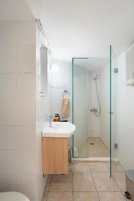 a bathroom with a sink and a shower at Scent Of Freedom Apartment Renovated in Athens