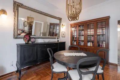 a dining room with a table and a mirror at Athens Parrot in Athens