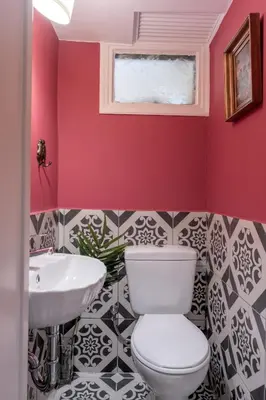 a bathroom with a white toilet and a sink at Athens Parrot in Athens