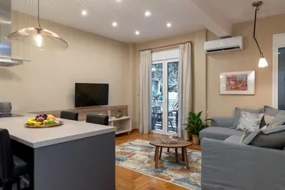 a living room with a couch and a table at Absolute Athens Apartments in Athens