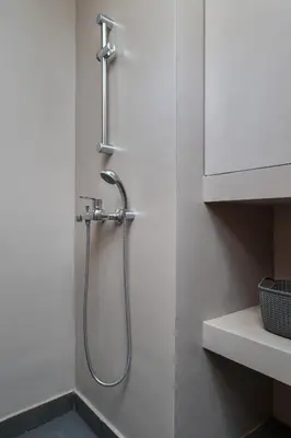 a shower in the corner of a bathroom at Absolute Athens Apartments in Athens