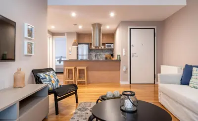 a living room with a couch and a table at Absolute Athens Apartments in Athens