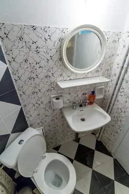 a bathroom with a toilet and a mirror at VIP Greece Petros in Athens