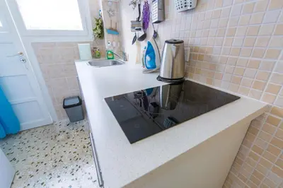 a kitchen with a sink and a counter top at VIP Greece Petros in Athens
