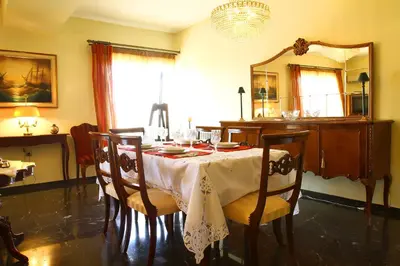 a dining room with a table and a mirror at Astonishing view in Athens