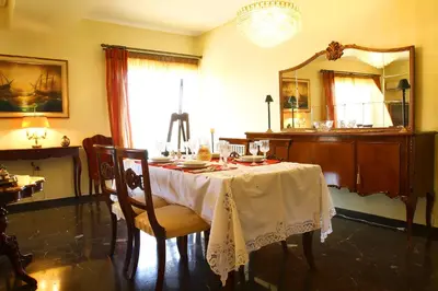 a dining room with a table and a mirror at Astonishing view in Athens