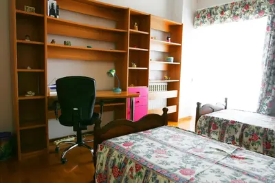 a bedroom with a desk and a bed and a chair at Astonishing view in Athens