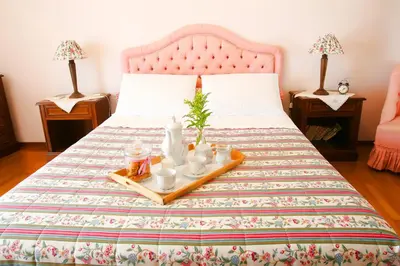 a bed with a tray of food on it at Astonishing view in Athens