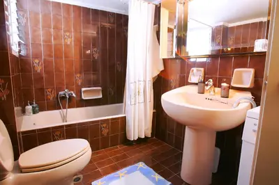 a bathroom with a toilet and a sink at Astonishing view in Athens