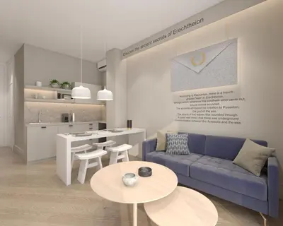 a living room with a couch and tables and a kitchen at Great Living Koukaki in Athens