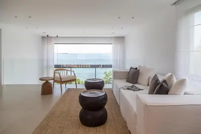 a living room with a white couch and a table at The Margi Villa in Athens