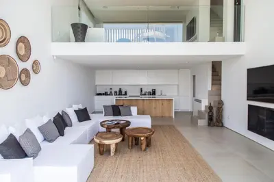 a living room with a white couch and a table at The Margi Villa in Athens