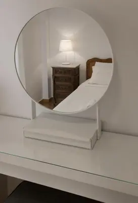 a bedroom with a mirror on a table at Edem BeachFront SeaView Dream Home In Beautiful Athens Riviera in Palaio Faliro in Athens