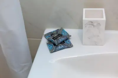 a white table with two ties and a box on it at Sweet Home VIPGreece in Athens