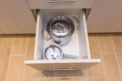 two pans in a drawer in a kitchen at Sweet Home VIPGreece in Athens