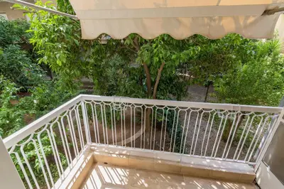 a staircase leading up to a building with trees at Sweet Home VIPGreece in Athens