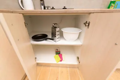 a cupboard with a kitchen utensils and a whisk at Sweet Home VIPGreece in Athens
