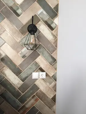a room with a wooden floor and aendant light at Electra & Myrto Apartments in Athens