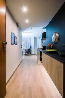 a hallway with a kitchen and a living room at Comfort studios in Kolonaki in Athens