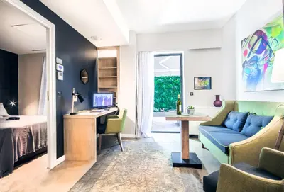 a living room with a couch and a desk at Comfort studios in Kolonaki in Athens