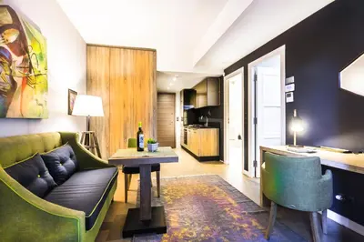 a living room with a couch and a table at Comfort studios in Kolonaki in Athens