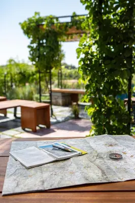 a wooden table with a map on top of it at The Foundry Suites in Athens