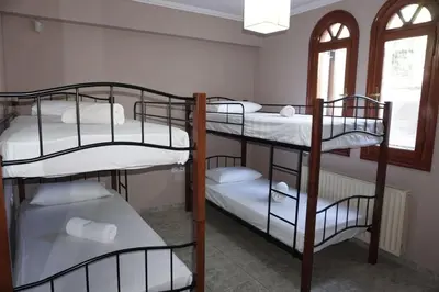 a group of bunk beds in a room at Athens Countryside resort with pool in Pallíni