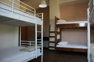 a dorm room with two bunk beds in it at Pella Inn Hostel in Athens