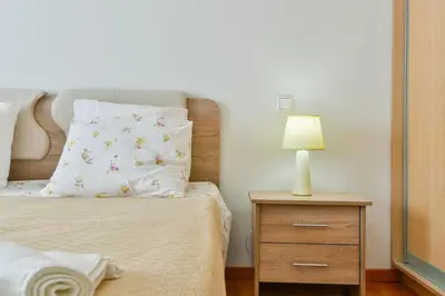 a bedroom with a bed and a nightstand with a lamp at Athens Memory in Athens