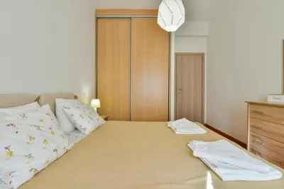 a bedroom with a bed with two towels on it at Athens Memory in Athens