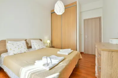 a bedroom with a bed with two towels on it at Athens Memory in Athens