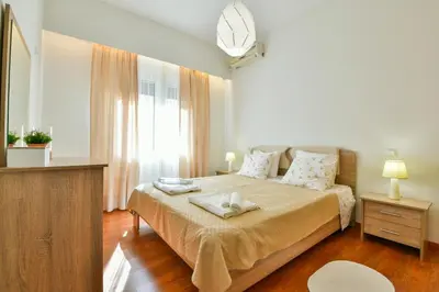 a bedroom with a bed with a tray on it at Athens Memory in Athens
