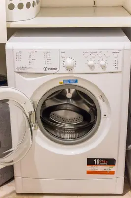 a white washing machine sitting in a kitchen at Stylish apt in Athens center in Athens