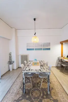 a dining room with a table and chairs at Stylish apt in Athens center in Athens