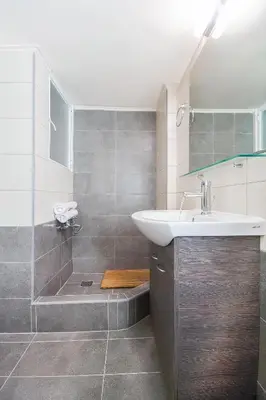 a bathroom with a sink and a shower at Charming and renovated flat in the heart of Athens in Athens